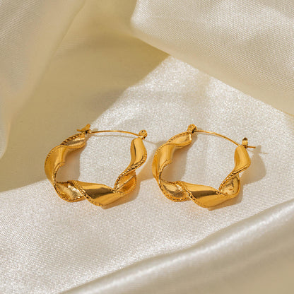 Rusty steel wavy gold earrings with a niche and high-end vibe for women